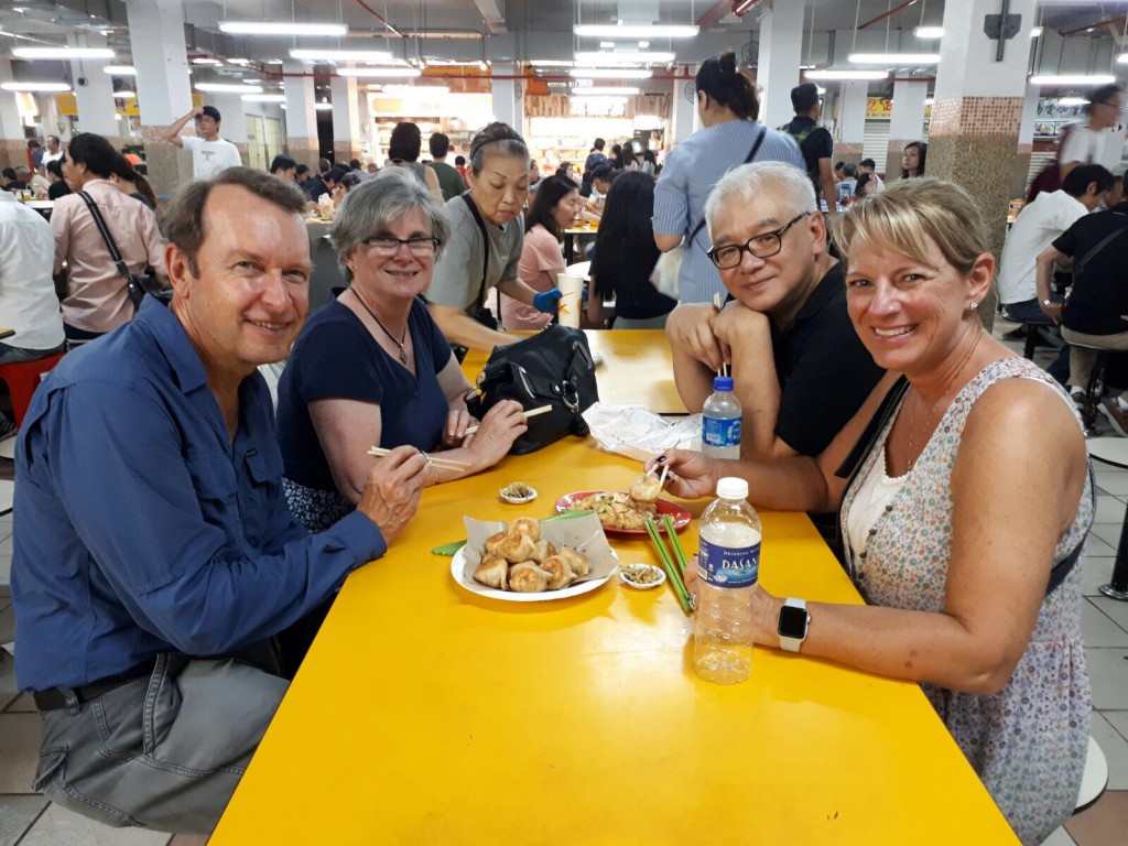 Guests enjoying a bite at a hawker centre in Singapore.