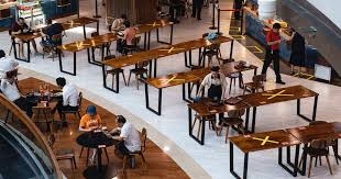 Singapore hawker centres using safe distancing seating.